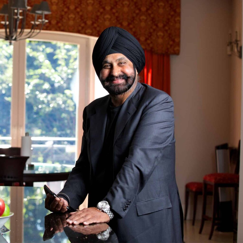 Headshot of Nav Bhatia, the official Raptors Superfan and business and DEI keynote speaker.