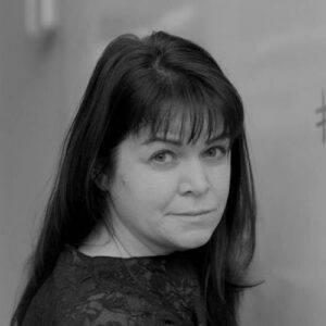 Maggie MacDonnell headshot in black and white.
