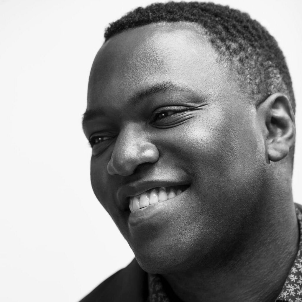 Black and white headshot of actor, Omari Newton
