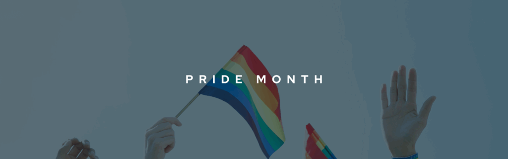 Decorative banner to celebrate Pride Month and LGBTQ2S+ speakers in Canada. The title "PRIDE MONTH" is shown in the centre in bold, white font. The background shows hands raised up with 2 rainbow pride flags being waved through the air.