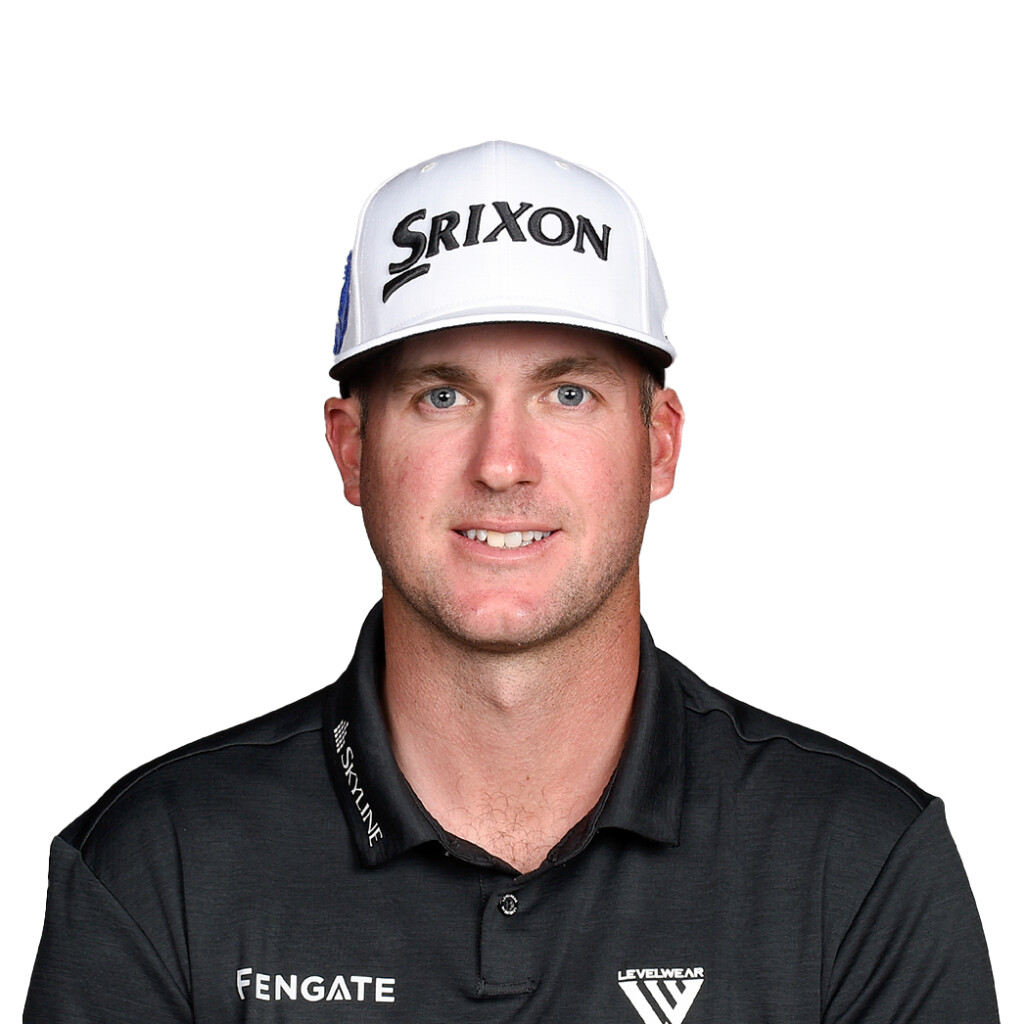 Typer Pendrith. Headshot of Tyler Pendrith wearing a black collared shirt and a ball cap that says "SRIXON". He is posing in front of a bright white backdrop.