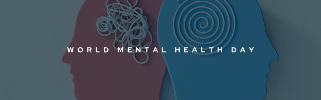 Decorative banner that reads "World Mental Health Day" in bold white text. The background image includes graphics of the silhouettes of the side profiles of a pink and blue human.