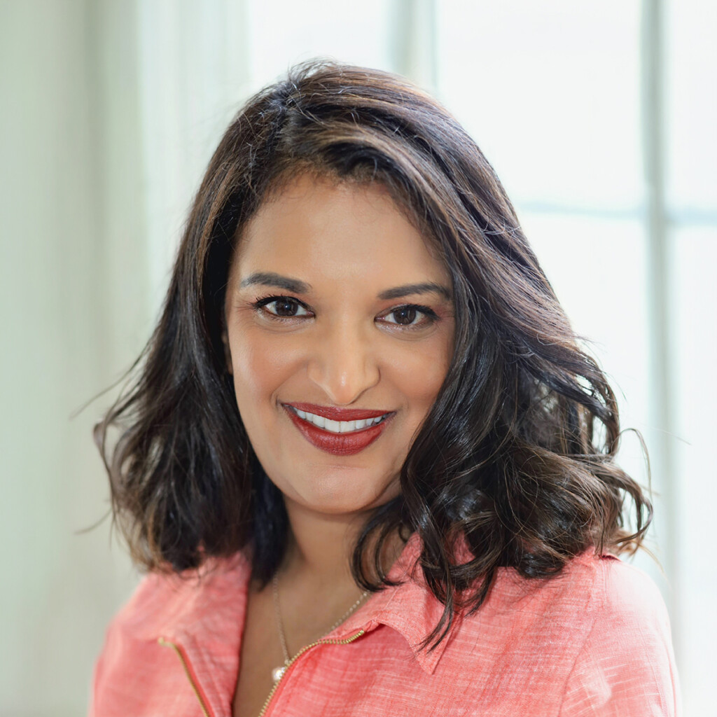 Professional headshot of Tina Varughese.